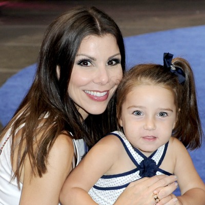 Heather Dubrow holding young Collette Dubrow.